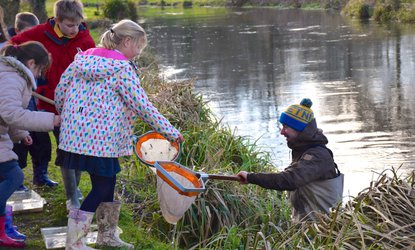 Wessex Chalk Streams and Rivers Trust staff delivering schools river education programme in partnership with Winchester College