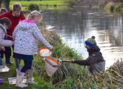 Wessex Chalk Streams and Rivers Trust staff delivering schools river education programme in partnership with Winchester College