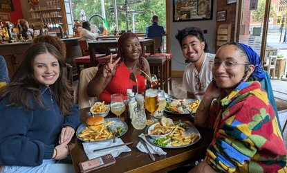 Members of the Involving Young People Collective having a meal during a Blue Spaces site visit.