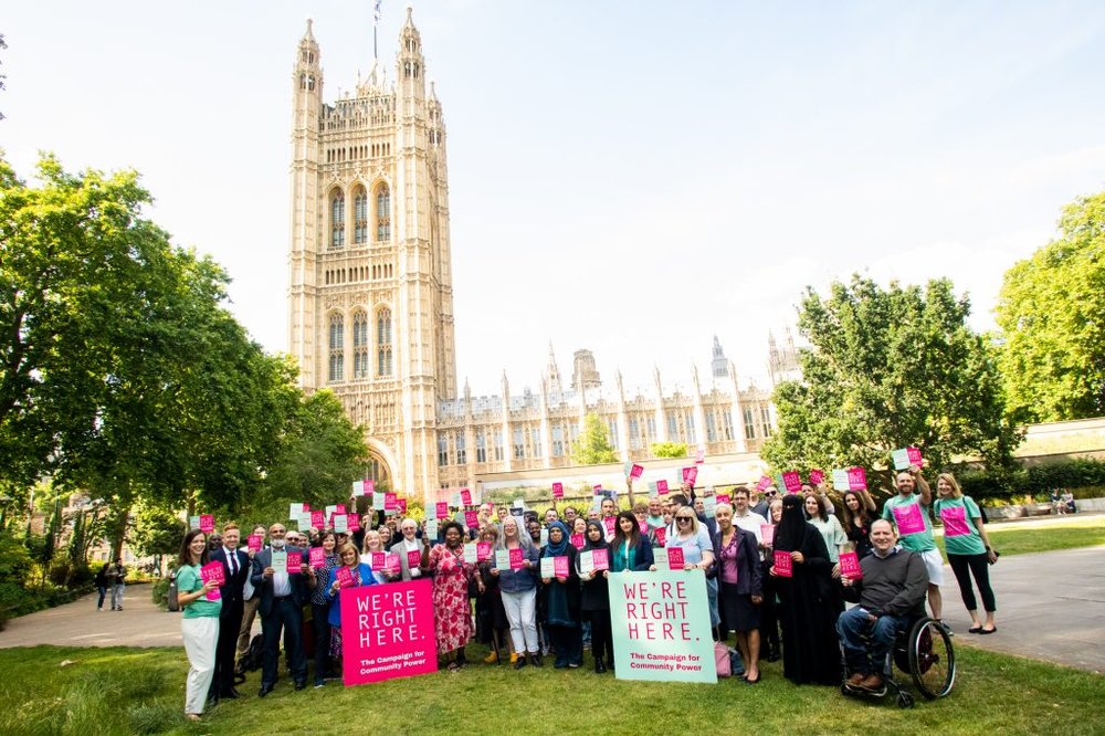 We're Right Here-Group of community champions stand outside the Houses of Parliament holding the 'We're Right Here' manifesto-Group-photo-1-1024x683