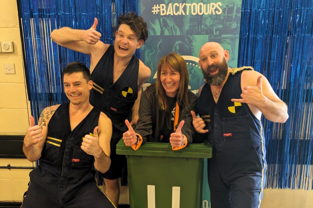 Back to Ours-four people smiling and giving a thumbs up as part of a show