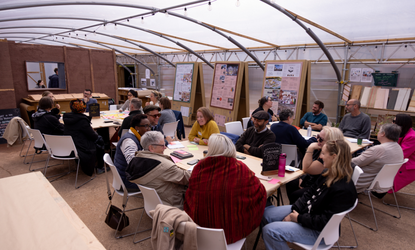 Groups of people convened by Esmée Fairbairn Foundation and Civic Square sat around tables having a discussion.
